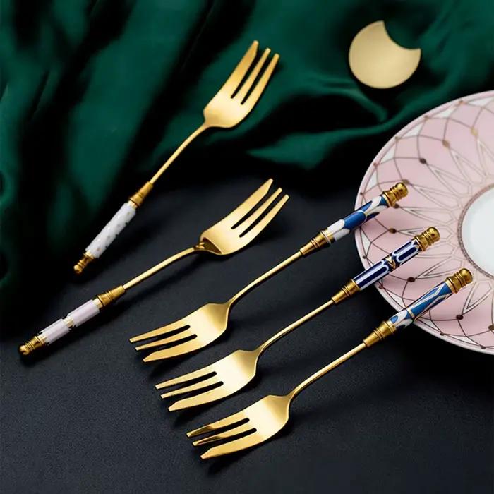 Fourchette à gâteau dorée en acier inoxydable vintage avec manche en céramique pour desserts et fruits occasions spéciales
