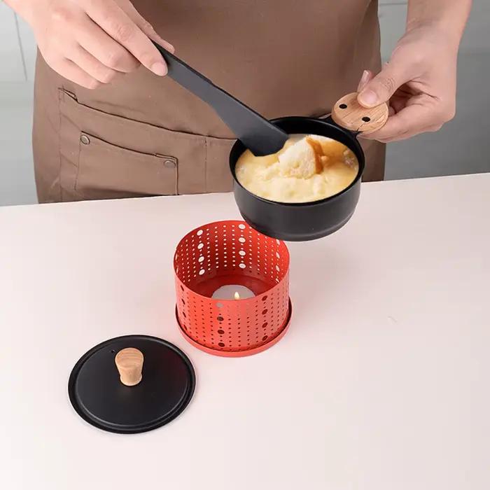 Chaudière à beurre cylindrique coupe-vent antiadhésive avec pelle poignée Anti-brûlure four à Raclette au fromage cuisson