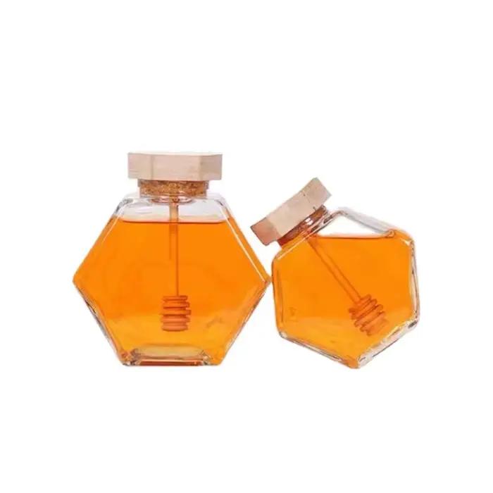 Bouteille de miel en verre hexagonale avec pot en bois