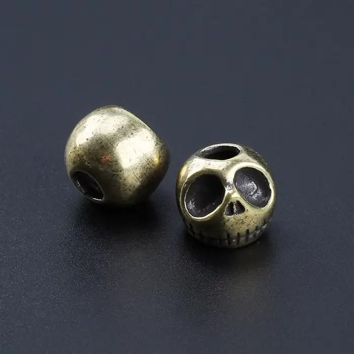 Couteau en laiton Punk citrouille crâne, perles, corde de parapluie, pendentif de couteau d'extérieur, accessoire paracorde EDC
