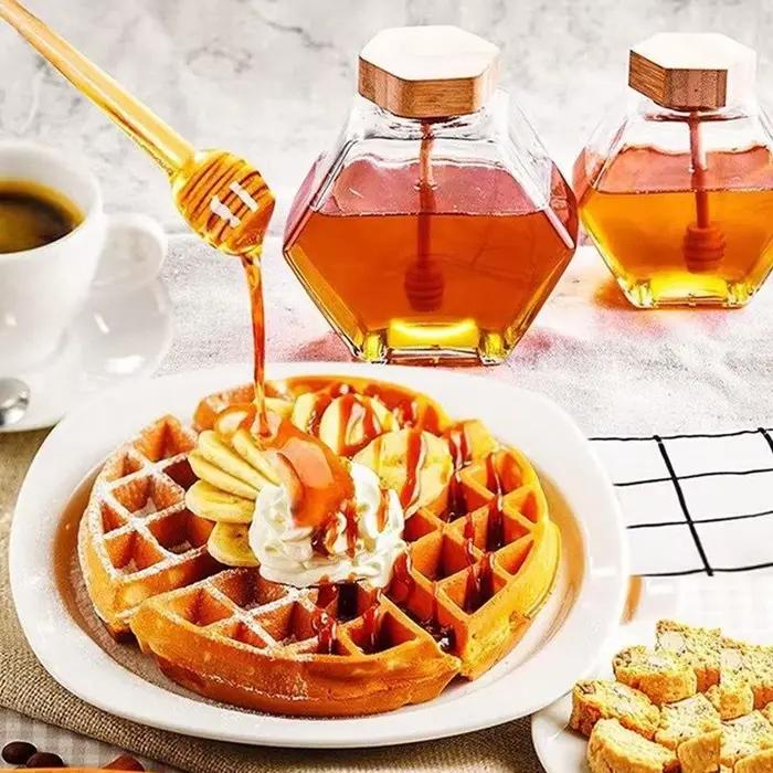 Bouteille de miel en verre hexagonale avec pot en bois