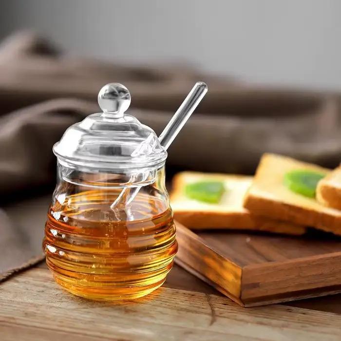 Récipient de stockage de miel précieux en accent d'abeille en verre avec louche et couvercle
