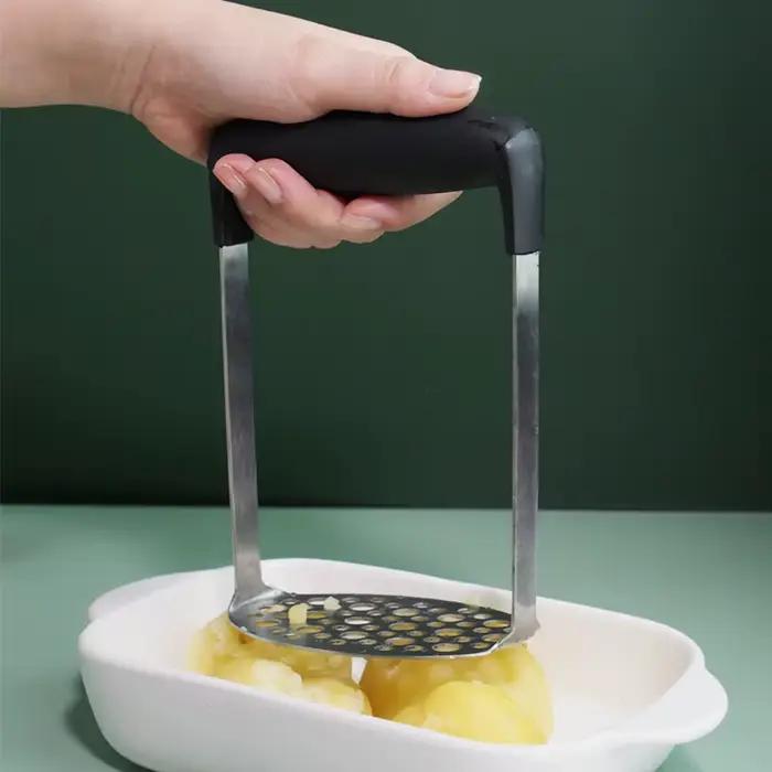 Poussoir de pommes de terre en acier inoxydable