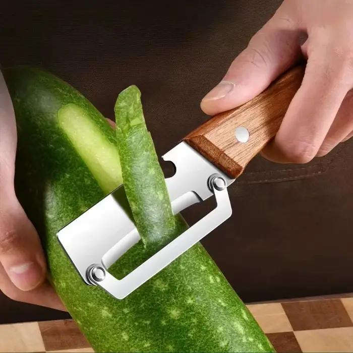 Éplucheur en acier inoxydable avec manche en bois pour éplucher et trancher les fruits et légumes | Fonctionnement