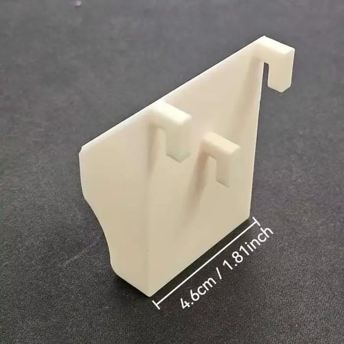 Support mural pliable Skadis pour règles et outils de mesure