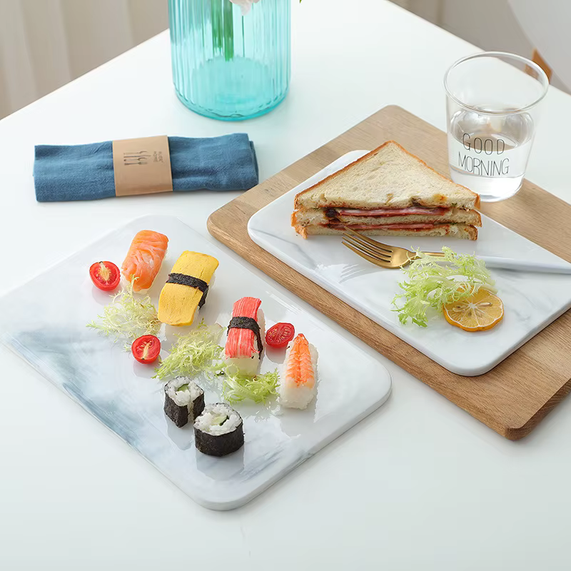 Planche à découper en marbre pour craquelins au fromage et sushi